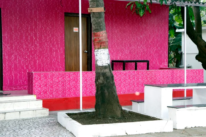 Pink painted room exterior and covered porch